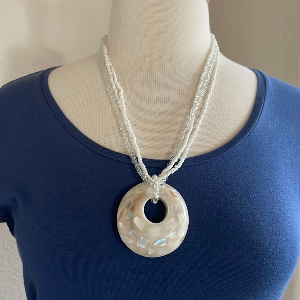 Multi-strand beaded necklace with beautiful wooden pendant